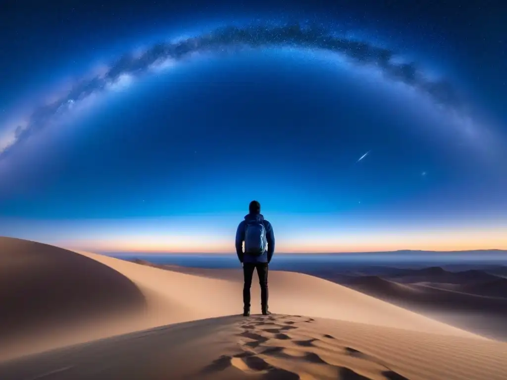 Una figura solitaria en un vasto desierto, contemplando bajo un cielo estrellado