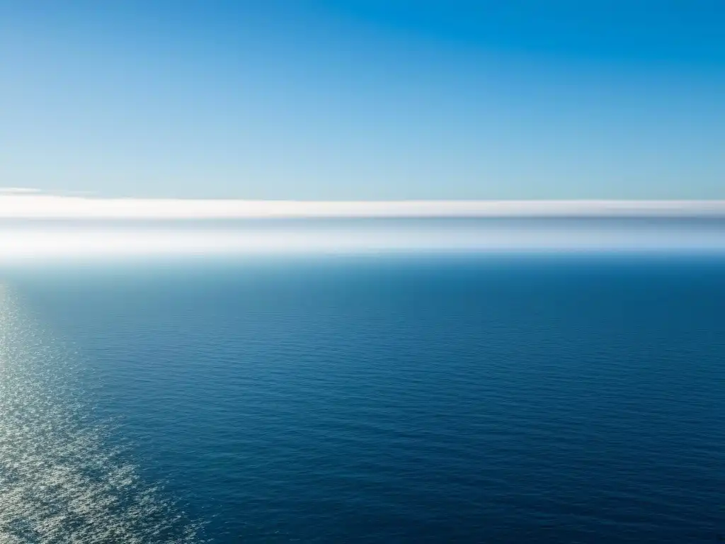 Un océano de tranquilidad refleja el arte de desaprender poesía en un cielo despejado y sereno